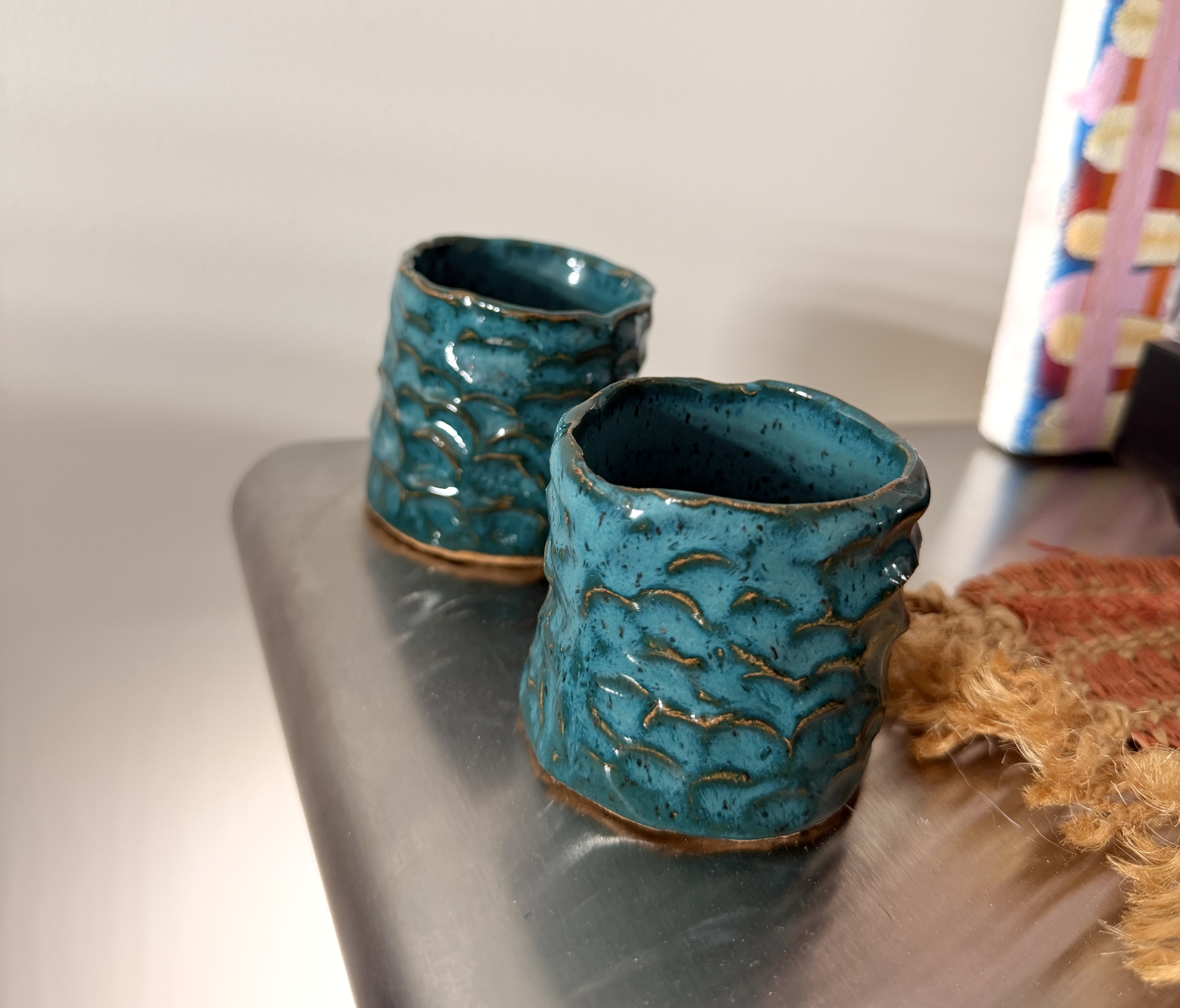 two ceramic cups made in class